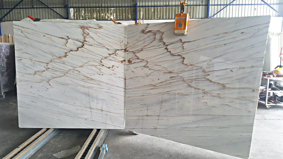 Book-matched pair of Calacatta Gold type marble slabs with the veins mirrored at the central joint